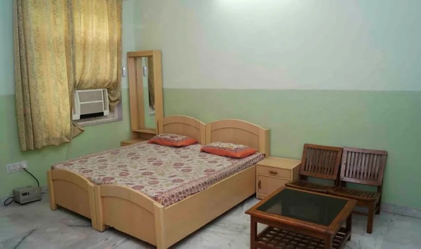 AC Deluxe room — floral bedding